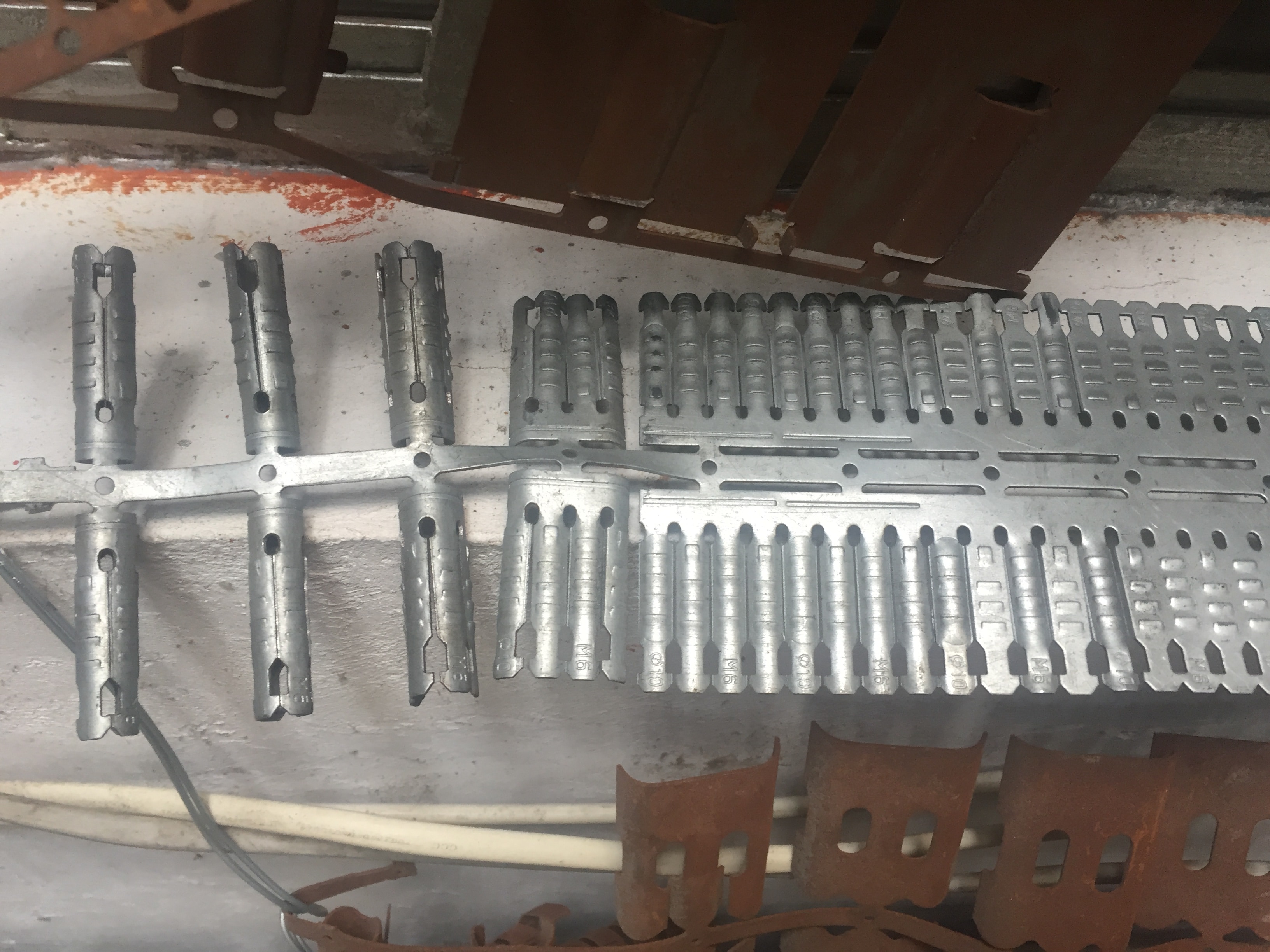 Anti skid rips shield anchor sleeves progressive stamping die