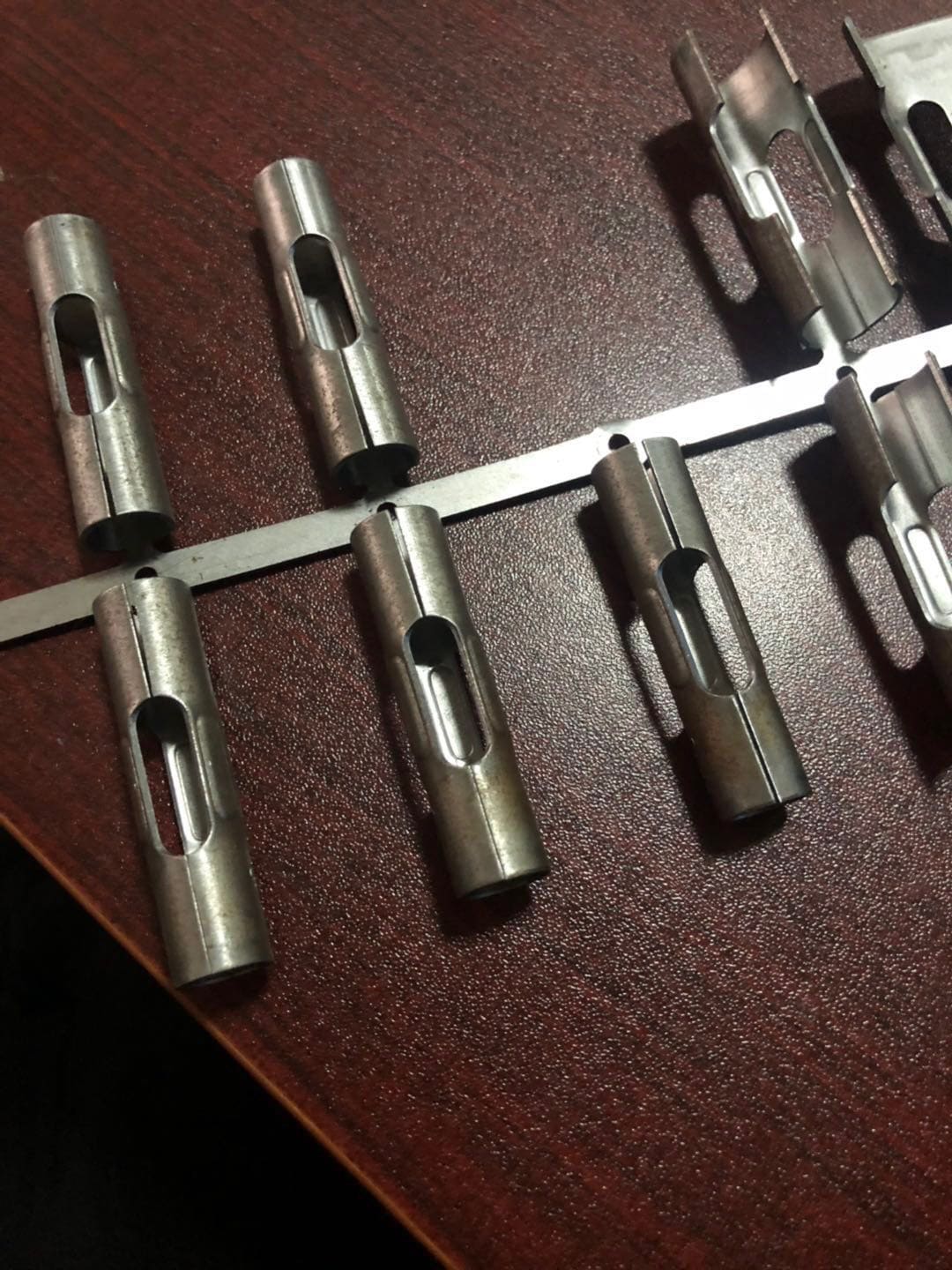 Sleeve anchor sleeves made by high speed progressive stamping die